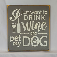 Load image into Gallery viewer, “I Just Want to Drink Wine and Pet My Dog” Funny handcrafted wood sign with an adorable paw print stamp and an image of a wine glass and bottle, 12x12 inches white font over Driftwood Grey. Rustic modern farmhouse home décor
