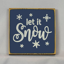 Load image into Gallery viewer, “Let it Snow” handcrafted wood sign with snowflakes, 5.5x5.5 inches White font over Navy Blue. Rustic modern farmhouse home décor